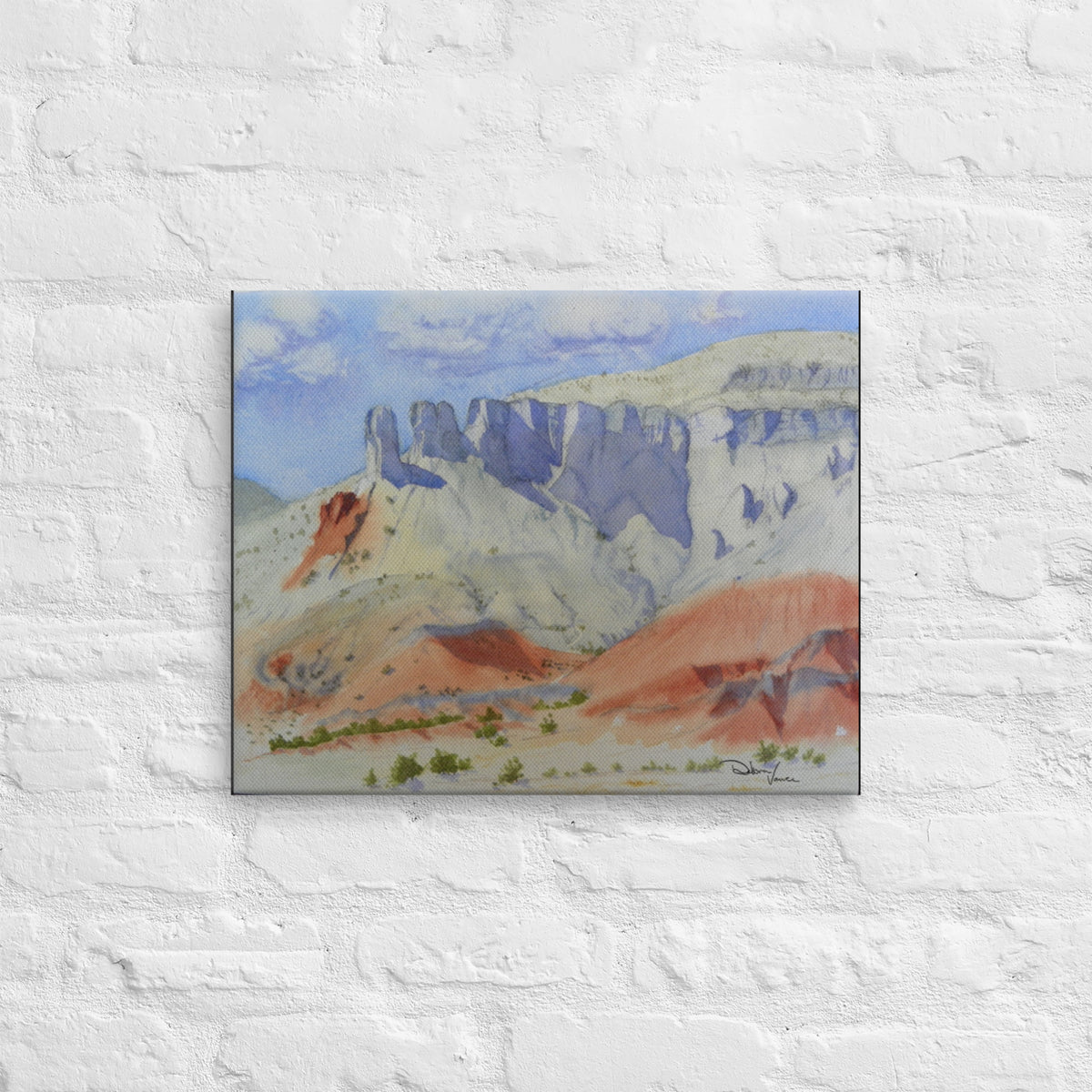 The Original painting was created in Watercolor by Debra Vance. It has SOLD. The painting depicts the white limestone cliffs draped in shadows. This is all above the orange sandstone desert floor. This is a real location north west of Santa Fe in New Mexico. Georgia O'Keefe painted there for many years. Ghost Ranch is also famous from the movie "City Slickers." 