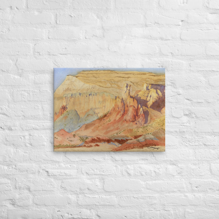 This is a Desert Landscape painting created by Debra Vance in Watercolor paint. The Original Painting SOLD immediately. The eroded sandstone spires and their shadows are depicted in yellow ocher, burnt oranges, with the light blue colors of other sedimentary rock. This desert landscape is located at Ghost Ranch near Abiquiu, NM. Georgia O'Keefe painted there for many years. Also famous from the movie "City Slickers." 